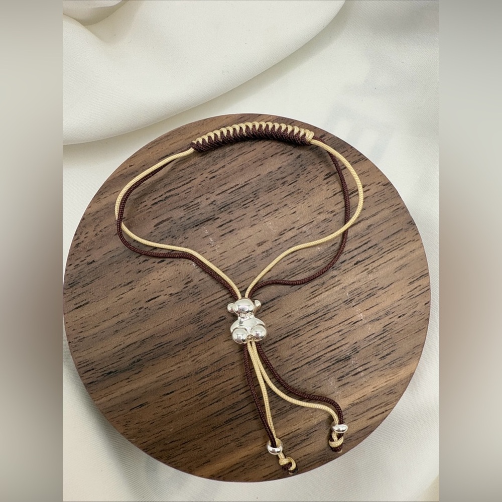 Bold Bear bracelet with two intertwined M And Cream 925